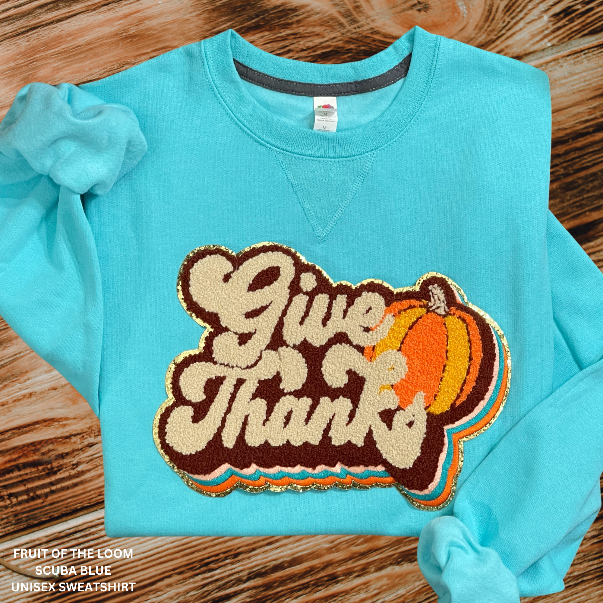 Give Thanks Chenille Patch With Gold Glitter Backing On Scuba Blue Sweatshirt: Sale